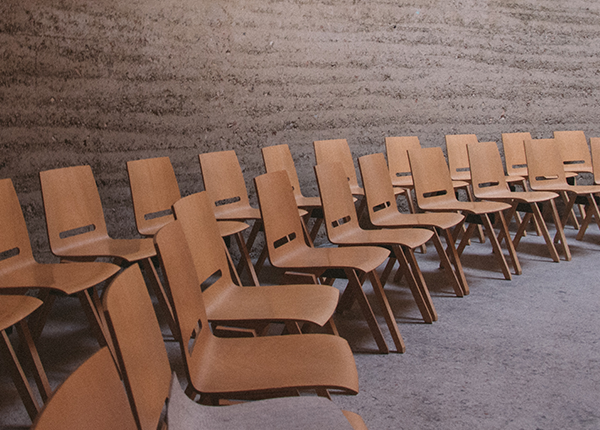 brown wooden chairs in a room