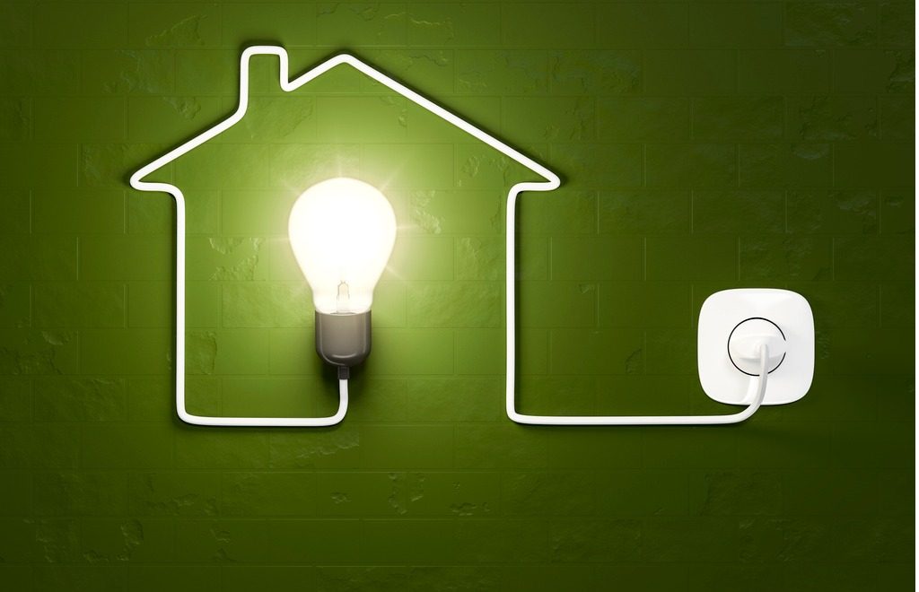 A light bulb building a house with the cable