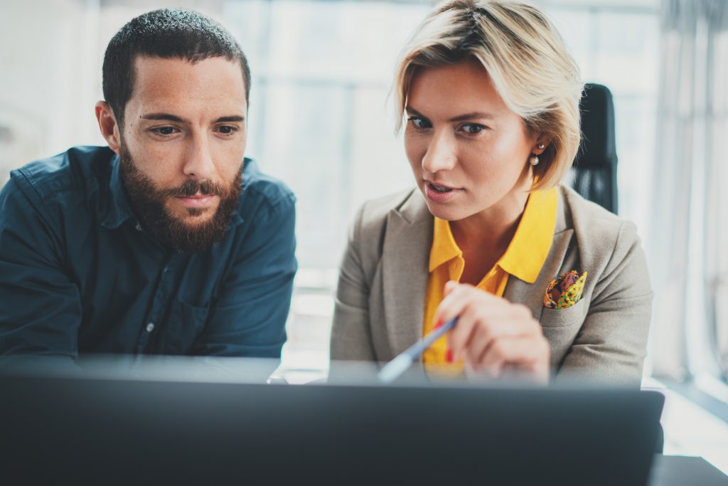 two people looking at computer screen together