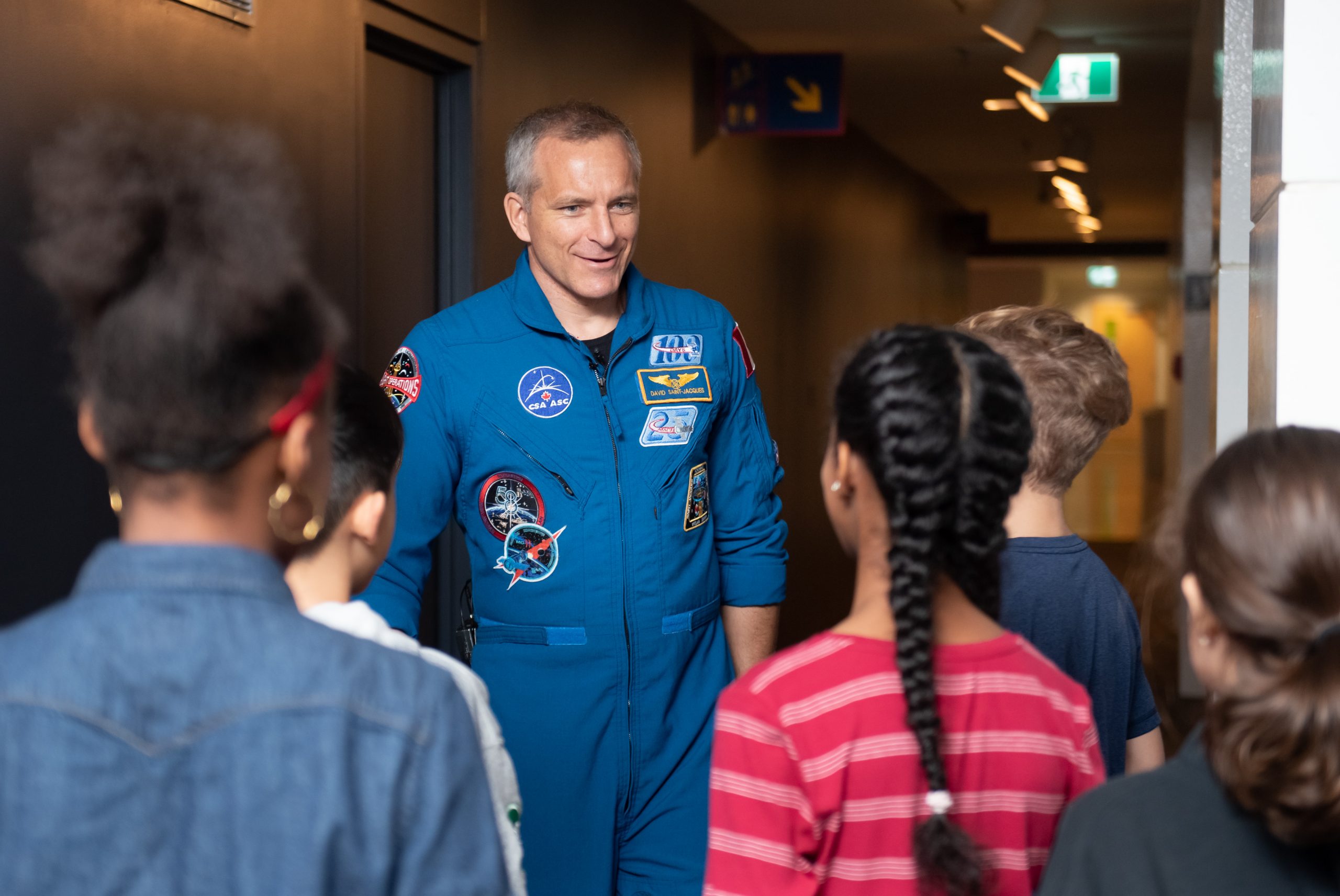 Astronaut David Saint-Jacques meets with children