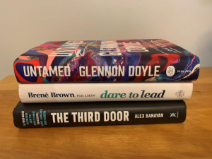Stack of books: Untamed, Dare to Lead, The Third Door