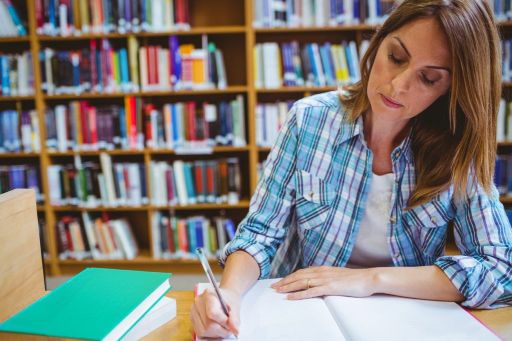 Mature student in the library at the university