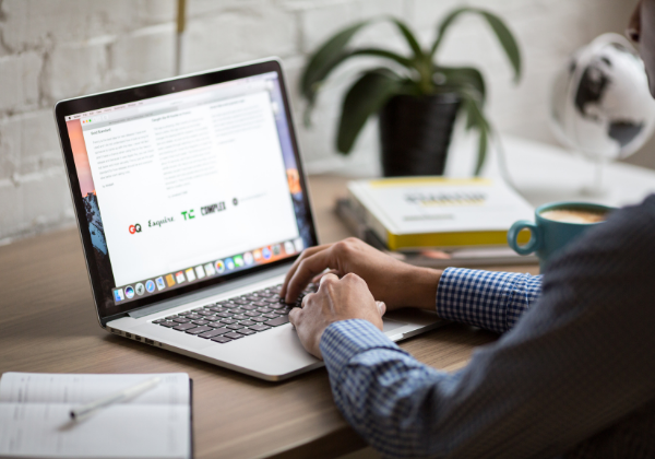 Person sitting in front of a laptop