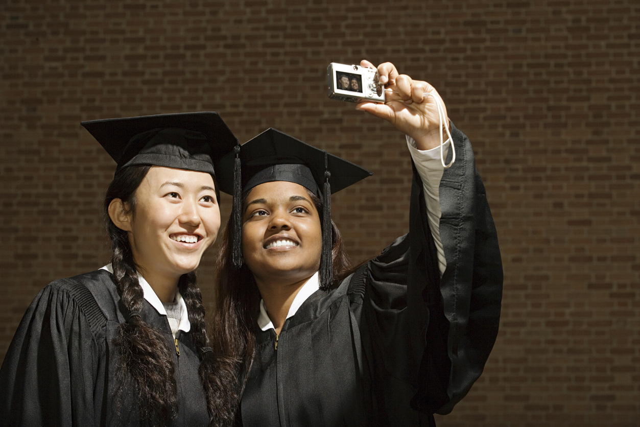 Two female graduates taking a selfie