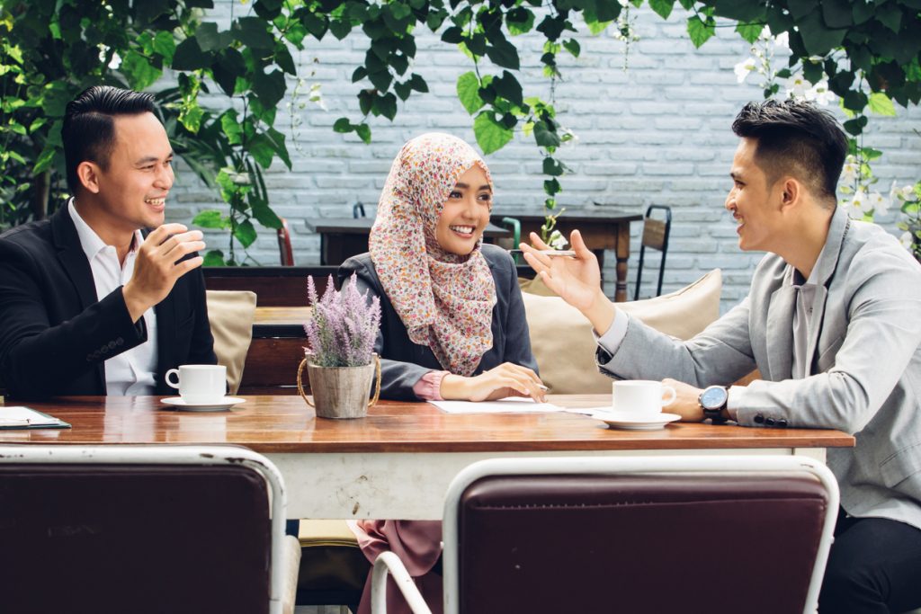 colleagues talking at cafe