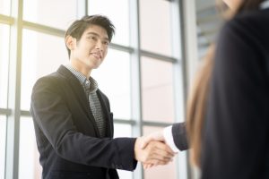 man and woman shaking hands