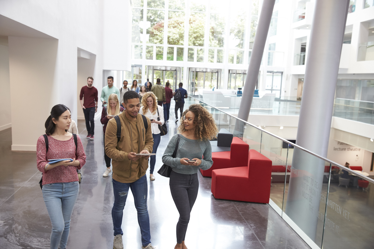 students walking and talking in university