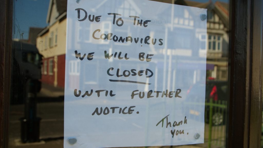 closed due to coronavirus sign on business door