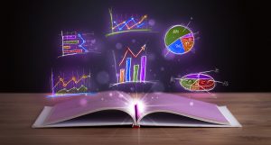 Book on wooden table with glowing graph illustrations and symbols.