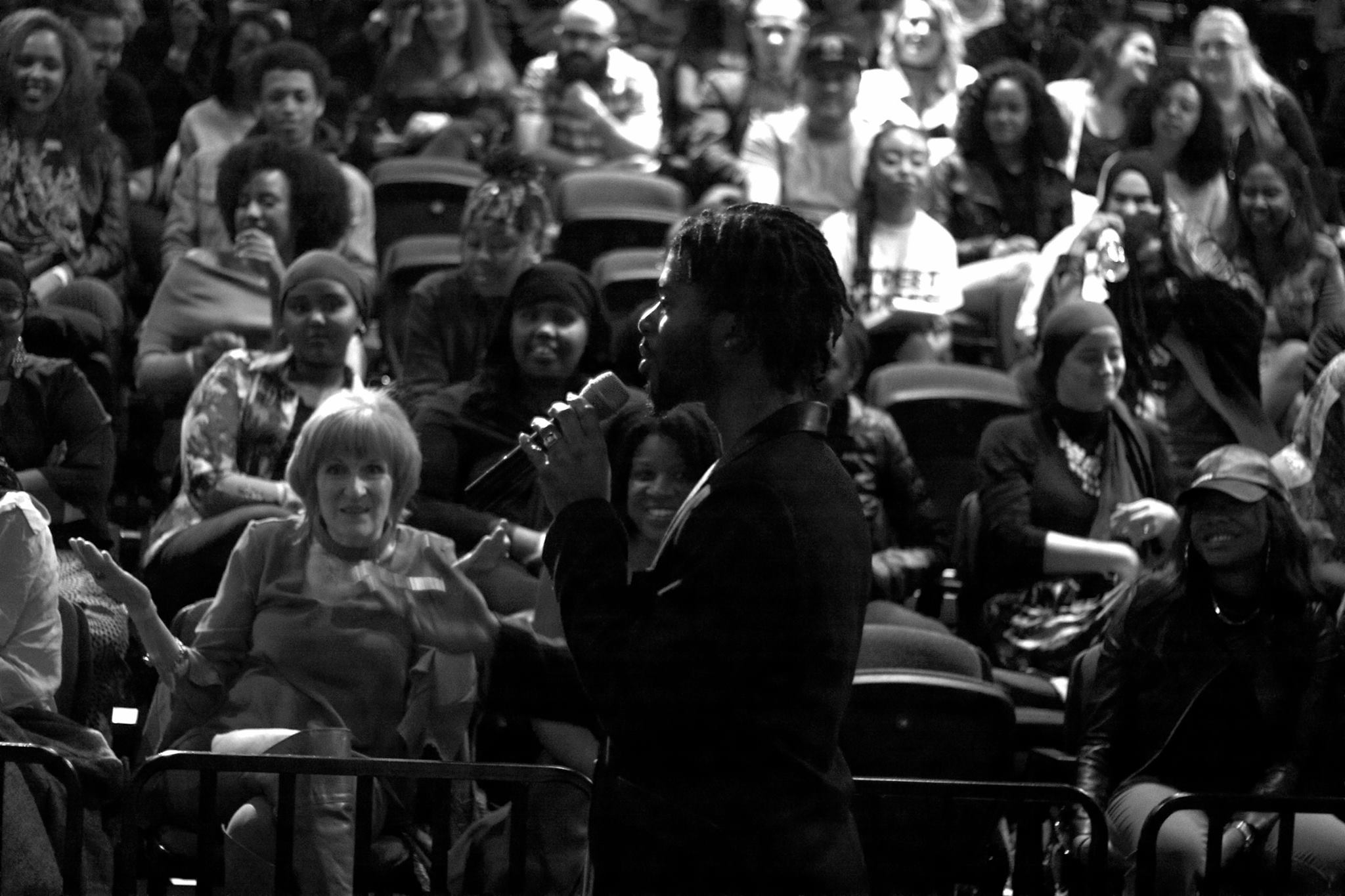 Randell Adjei speaking at event.