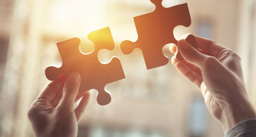 Businesswoman hand connecting jigsaw puzzle, Business solutions, success and strategy concept
