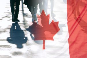 Photo of Canadian flag overlaid on top of image of people walking