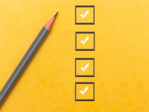 Pencil beside checkboxes on yellow background