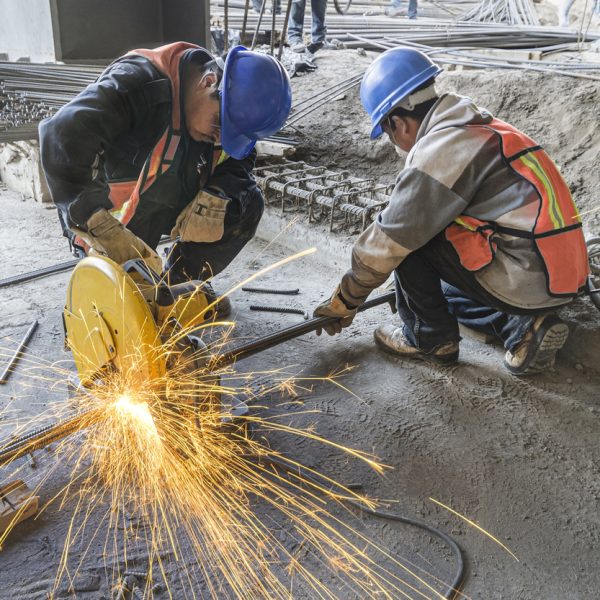Heat sparks fly out in construction site due to cutting with a grinding machine