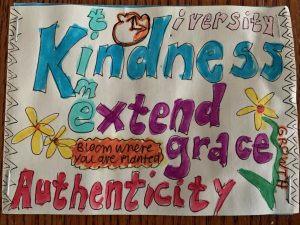 Paper with hand-drawn lettering: Diversty, Kindness, extend grace, Authenticity