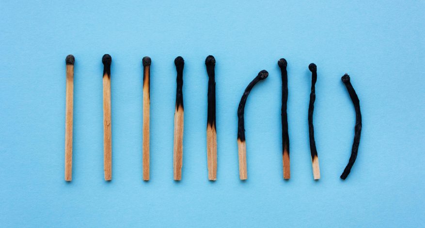 Burned matches on blue background