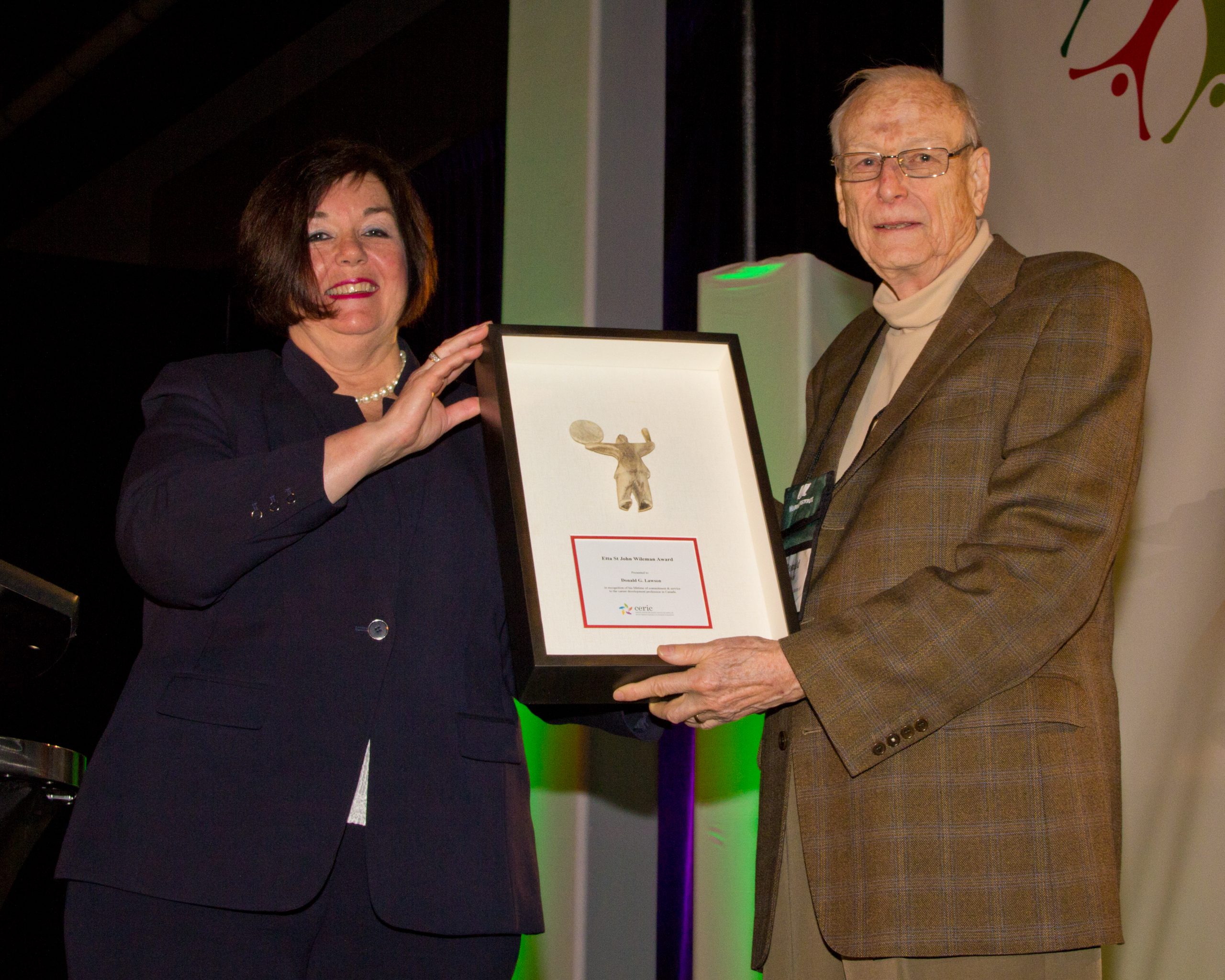 Donald Lawson receives the Etta St John Wileman Award for Lifetime Achievement in career development from CERIC Board Chair Jan Basso during the Cannexus15 conference.